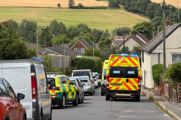 Ambulances have closed a road at Threshers in Crediton.  AQ 6780
