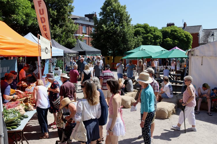 People enjoying the festival in Crediton Town Square