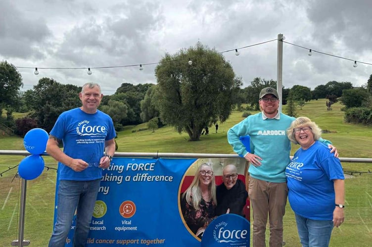Matt Robins, second left, with Phil and Karen Povey.