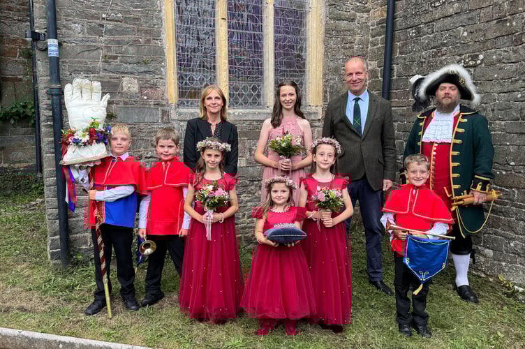 Chulmleigh Fair Queen Hannah Crossley with her attendants, Scarlett Crocombe and Daisy Peacock with Chief Herald Jens Rives-Roberts and Heralds Albert Summers and Frank Peacock plus Crown Bearer Fern Peacock. Also pictured Michael Johnson and Mrs Laetitia Johnson and Town Crier Ben Farlam. AQ 7243
