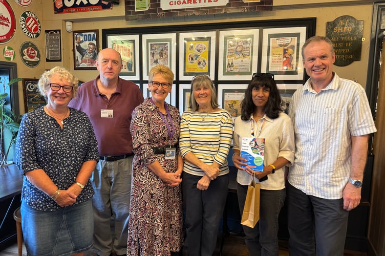 From left, Shauna Miles and John Potter from Age Concern Crediton; Emma Healey, Crediton Community Builder; Elizabeth Brookes-Hocking, Crediton Town Councillor; Bernadette Chelvanayag from Ecoe Advice and Dominic Myers, Manager, The Bookery. AQ 7810