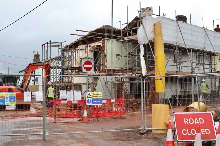 Road closure at The Cross Hotel, Copplestone. Much of the front of the pub has been demolished