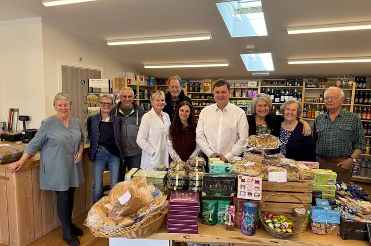 When Mel Stride MP met councillors, trustees, shareholders, volunteers and the manager of Kennerleigh and District Community Stores, which was purchased by shareholders and has been expanded into its refurbished former premises. It now has a wonderful café alongside the shop and Post Office. Mr Stride supported the Stores committee through its journey.  AQ 7468

