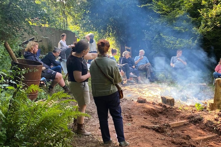 Attendees enjoying campfire at the woodland venue