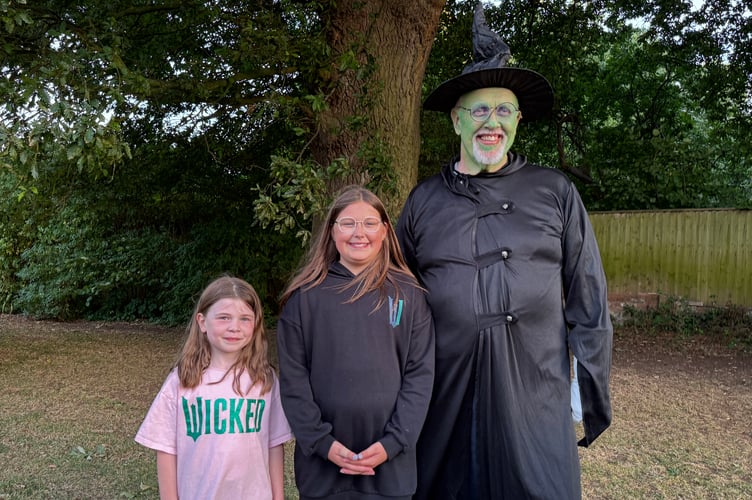 The Mayor of Crediton, Cllr Steve Huxtable, dressed as Elphaba, from the film ‘Wicked’, which was watch by 350 people in Newcombes Meadow. AQ 8407
