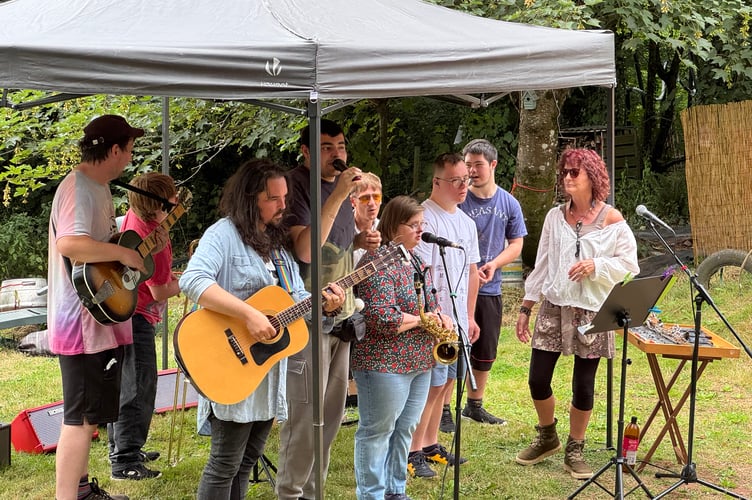 Turning Tides members performing at Four Mills Garden as part of Crediton Heart Project’s Summer Arts Festival. AQ 8057