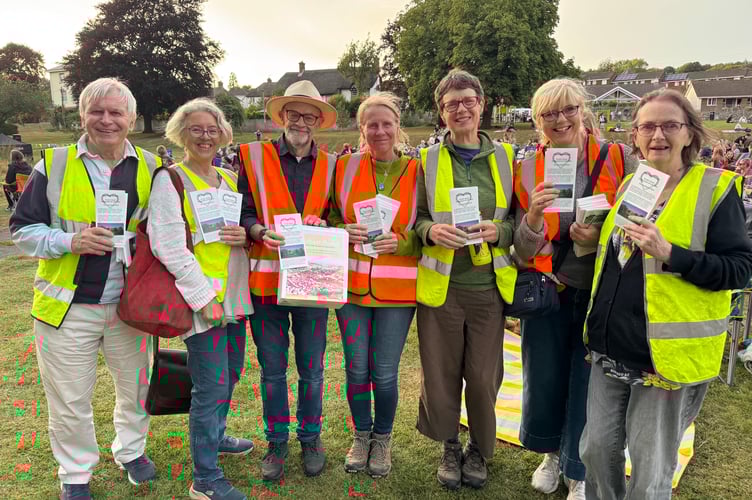 Crediton Heart Project members and volunteers asked those attending the outdoor cinema to fill out its survey about plans for an arts and community centre in Newcombes Meadow. AQ 8400