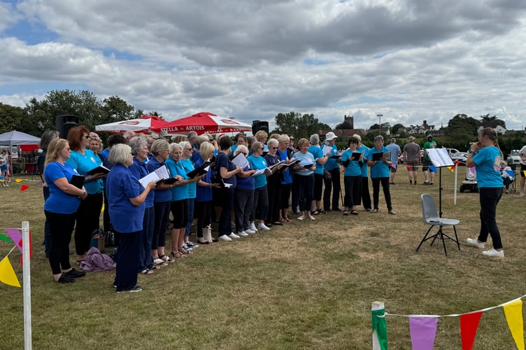 The fantastic Copplestone Choir sang to entertain at Morchard Bishop Family Fun Day. AQ 8245