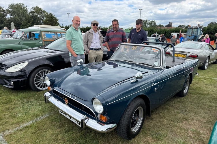 Admiring a Tiger Sunbeam at Morchard Bishop Vintage Rally. AQ 8188