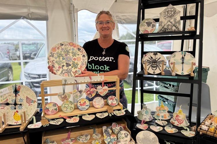 Suzie in Devon runs party events, workshops in Indian Block Printing and Pottery and had a stall of her own decorated pottery at the Fun Day. AQ 8137