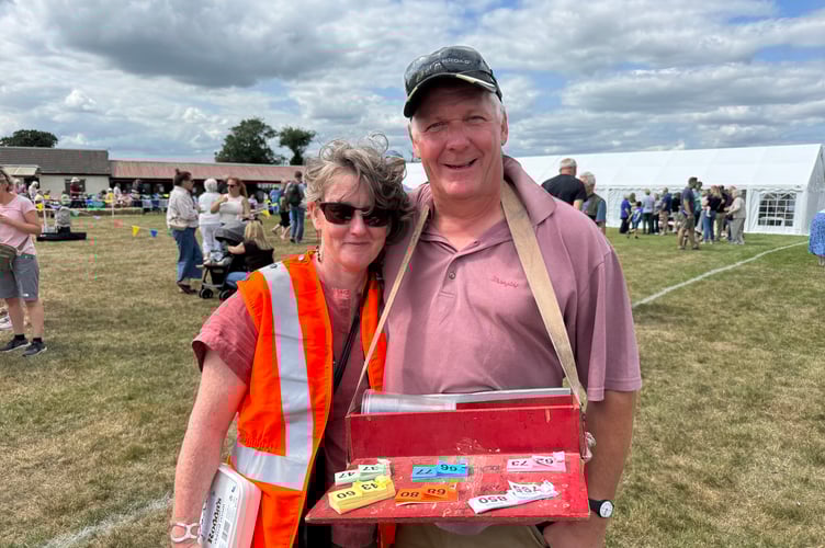 Toni Robinson, Morchard Bishop Playing Field Association treasurer and her husband Bob, Association chair, were busy at the Fun Day. AQ 8271