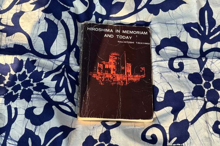 The book Hiroshima in Memoriam and Today by Hitoshi Takayama was at the centre of the Hiroshima Vigil held in Crediton. AQ 8582