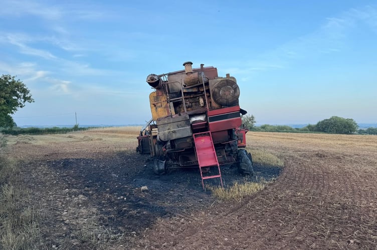 The combine harvester after the fire had been put out.

