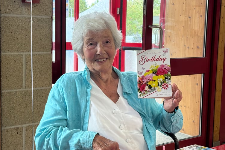 Brenda Fletcher with one of the birthday cards she received on her 95th birthday. AQ 8620