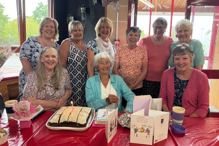 Brenda Fletcher, seated, centre, with some of the Aquafit class members on her 95th birthday at Lords Meadow Leisure Centre.  AQ 8614
