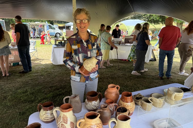 Caroline Ralph of Caro Ceramics sold some of her terracotta slipwear pottery items at Arts in the Park. AQ 8887