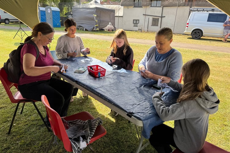 Preparing for print-making at Arts in the Park. AQ 8833