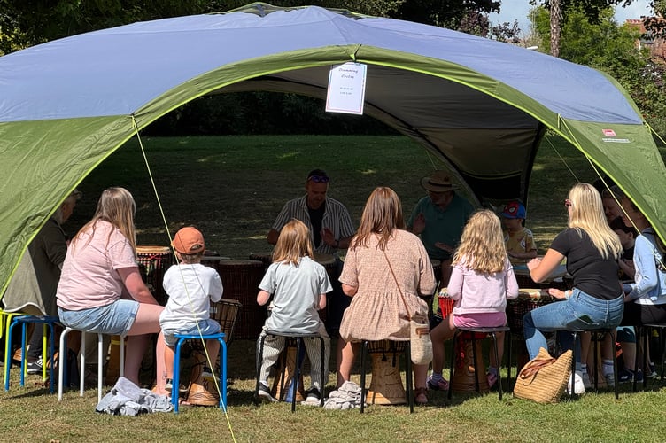The drum workshop was popular at Arts in the Park. AQ 8874