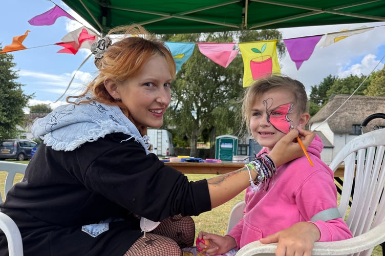 Facepainting was popular at Arts in the Park. AQ 8827