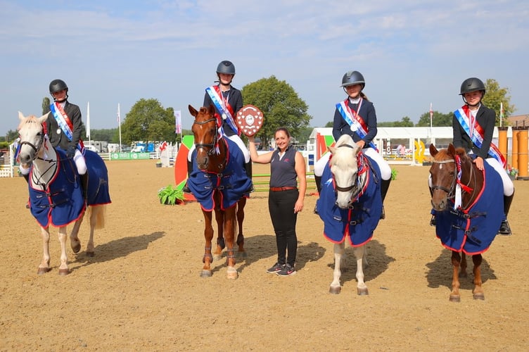 The QE Equestrian team receiving the trophy after becoming 60cm British Showjumping Just for Schools Champions.
