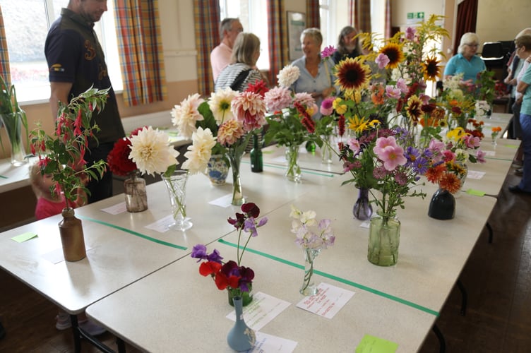 Floral exhibits at the 2023 Zeal Monachorum Village Hall Vegetable, Flower and Homecraft Show.
