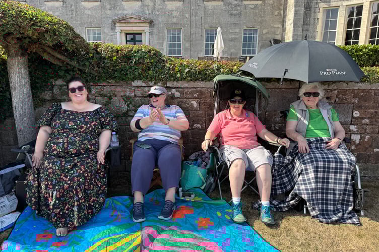 Sheltering from the sun to watch Crediton Town Band concert at Downes.  AQ 0741
