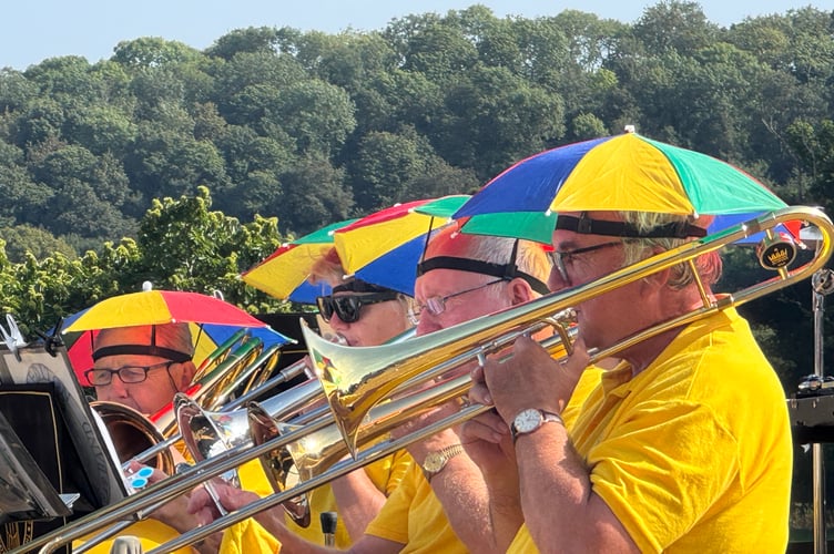 The trombone section wore some appropriate headwear for rain or shine.  AQ 0760
