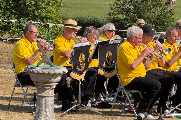 Some of the band members playing with musical director, Iorwerth Pugh, conducting. AQ 0734