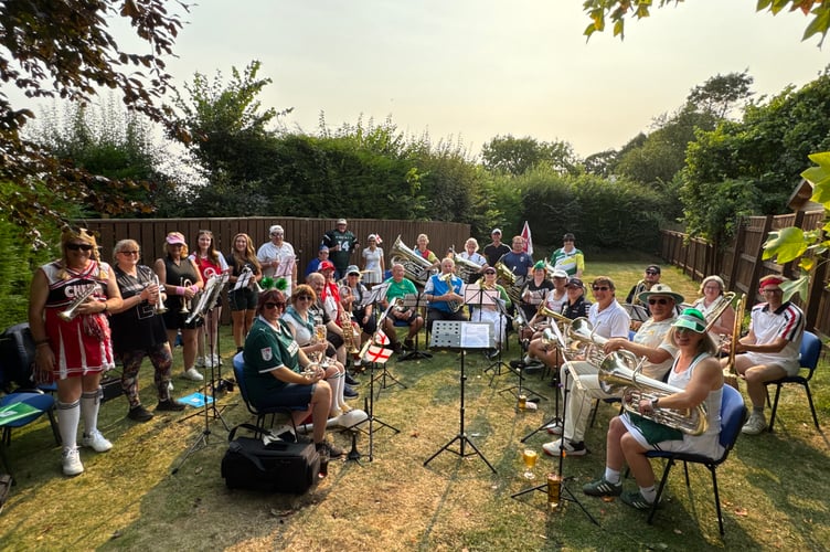 Many bands dressed up in costume for the occasion, the Hampshire Harlequins in a sporting theme, pictured at the Tom Cobley Tavern at Spreyton.  AQ 0478
