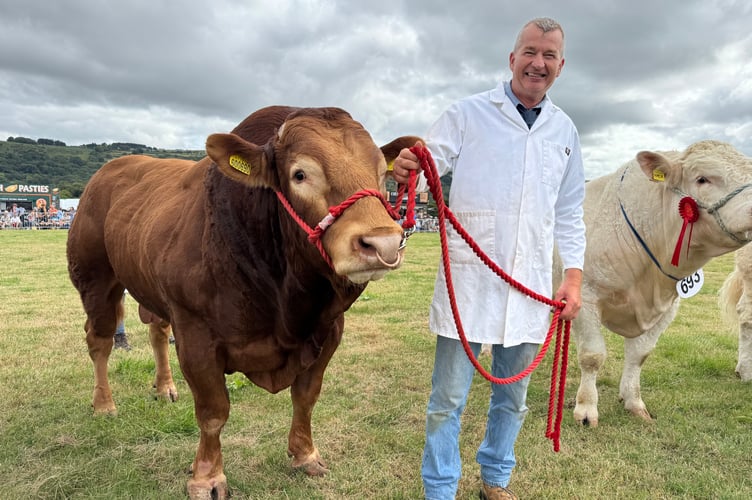 Gary and Lorraine Dunn of Highridge, Sampford Courtenay, won the Champion Limousin class with Highridge Oscar. AQ 0181
