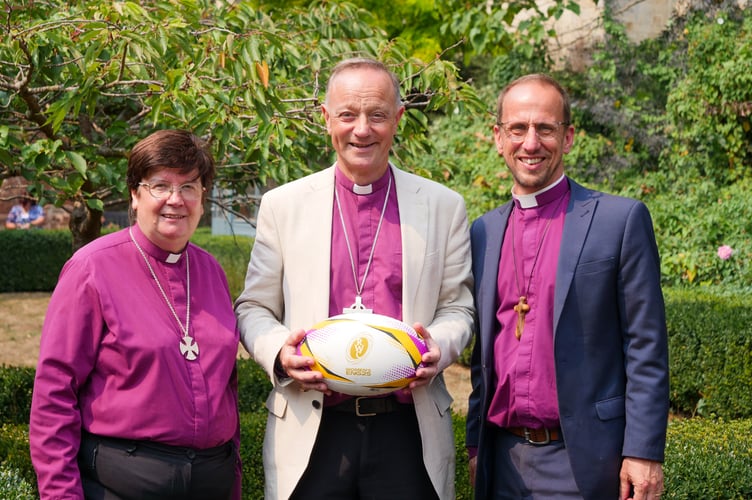 The Bishop of Exeter, the Rt Rev Dr Mike Harrison, centre, holding a rugby ball with The Bishop of Crediton, the Rt Rev Moira Astin, left and The Bishop of Plymouth, the Rt Rev James Grier.
