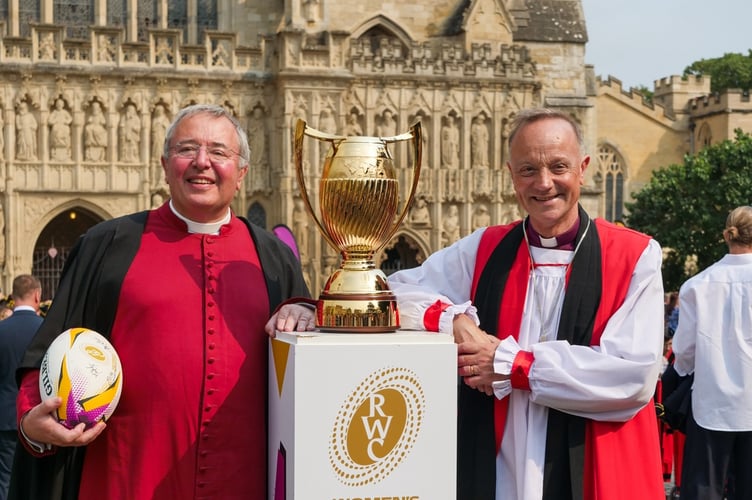 The Dean of Exeter Cathedral, the Very Rev Jonathan Greene, left and The Bishop of Exeter, the Rt Rev Dr Mike Harrison with the Women’s Rugby World Cup.