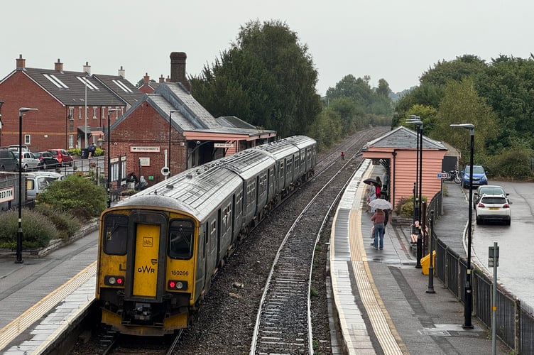 A train en route from Barnstaple to Exeter during the stop at Crediton Railway Station. AQ 0864