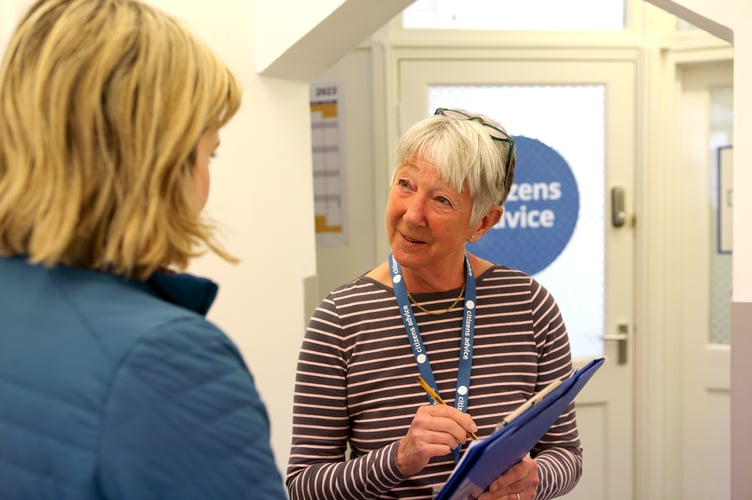 A Citizens Advice volunteer talking to a client.
