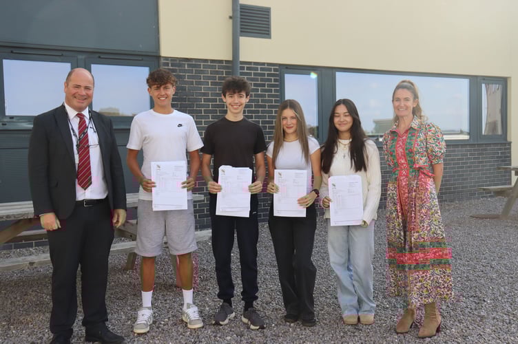 Chulmleigh Headteacher Mr Payne and Ms Thorncroft, Deputy Headteacher with four high performing students, Francesca Trimming who gained 11 GCSEs, Lottie Jackson who gained 10 GCSEs, Harrison Jordan who gained 10 GCSES and Samuel Cummings who gained 10 GCSEs.
