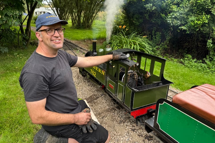 Alistair Hall preparing steam engine Lyn for a trip at Lapford Mill. AQ 8066