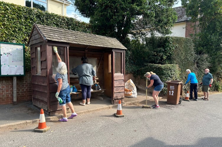 A group of villagers at work on the tidy-up