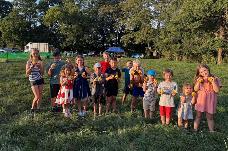 Some of the young people who went along to the duck race holding some of the ducks. AQ 1429