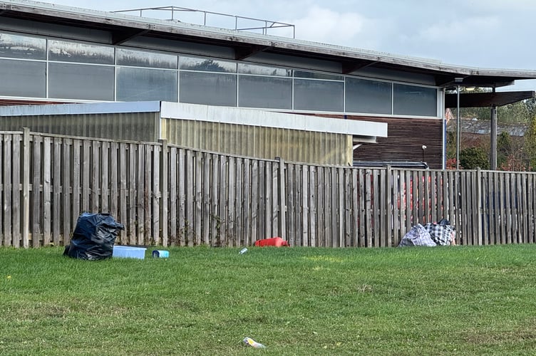 Some of the rubbish left behind on the grassed areas at the back of the Crediton Tesco superstore. AQ 3064