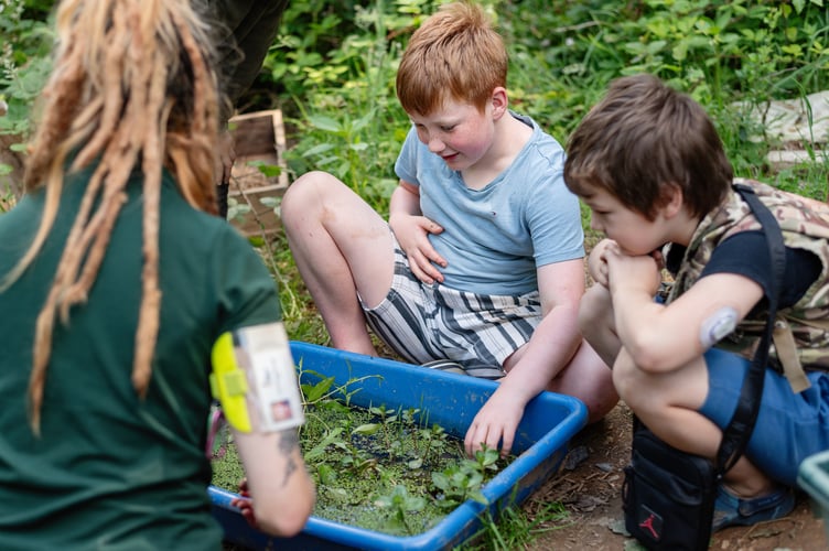 The Outdoors School students with staff members.
