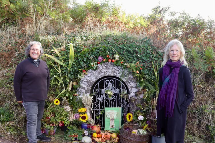 13 September 2025 Shobrooke Harvest Festival Rev Sandra Collier with Joy Moore, who decorated the holy well for the celebration (Will Goddard, Crediton Courier)