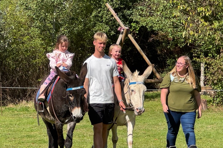 Enjoying a ride between races at Sandford School Donkey Derby.  AQ 2831
