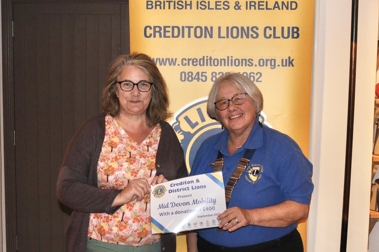 16 September 2025 Lions Club firewalk certificates Crediton Lions Club President Ann Whitehouse with Sarah Holmes of Mid Devon Mobility (Will Goddard, Crediton Courier)