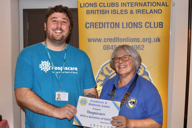 Crediton Lions Club President Ann Whitehouse with Hospiscare Area Fundraiser Ben Lovering