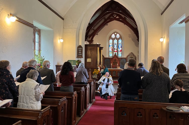 During the singing of one of the hymns at Thelbridge Parish Church, Gill Smith playing the organ.  AQ 2968
