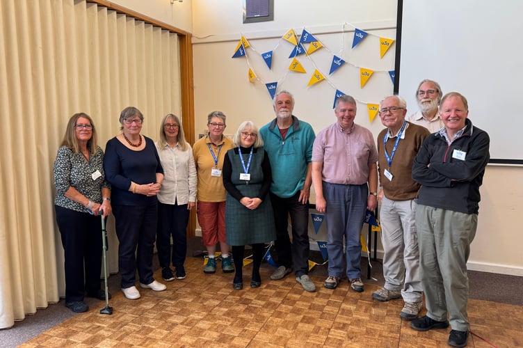 Members of the Crediton and District u3a committee on the 10th anniversary, from left, Ros Reeves, Fenella Rundell, Jo Penning, Carole Thomas, Liz Ouldridge (Chair), speaker Martin Pailthorpe, David Greenwood, Keith Barker, Ian Fenn and Jerry Lee. Three committee members not present.  AQ 3176
