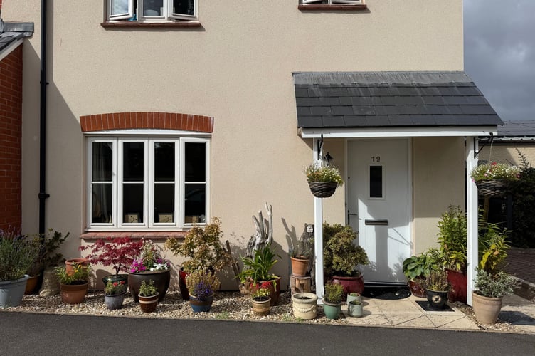 Yvette Mason of 19 Creedy View, Sandford, received a second prize for her hanging baskets and containers.  AQ 1564

