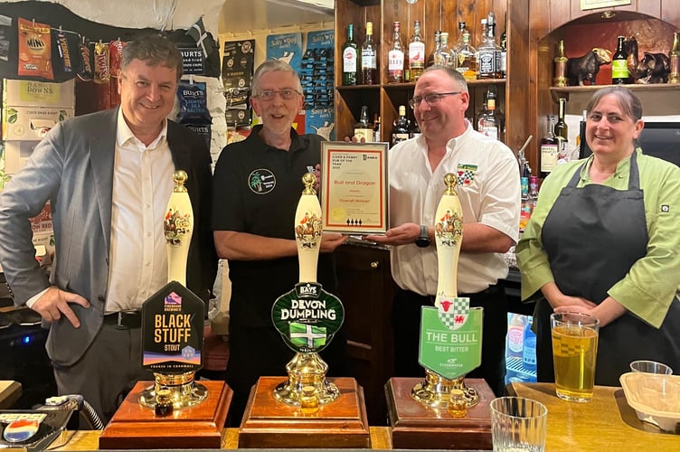 Mel Stride MP at the Bull and Dragon with Mike, Becky and their award from CAMRA. 

