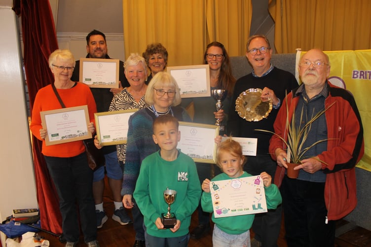 Newton St Cyres residents and organisation representatives with the array of awards won by the village in their first-ever entry into the South West in Bloom competition with Christine Fraser, fourth left.  AQ 0805
