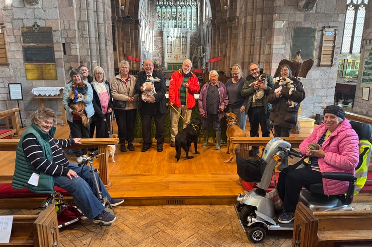 Rev Matthew Tregenza, standing, second right, with some of those who attended the pet service in Crediton Parish Church.  AQ 4918

